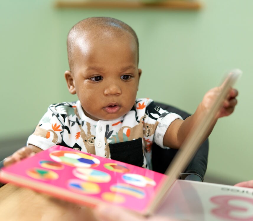 boy reading a book at Brain Health Center